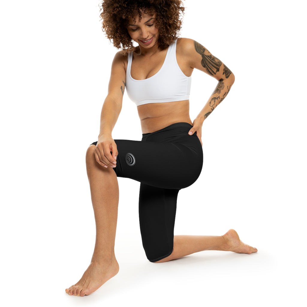 "Particle Oscillations As An Energy Generator."™ - Capri Leggings — Minimal Black Activewear with Subtle Vertical Text
