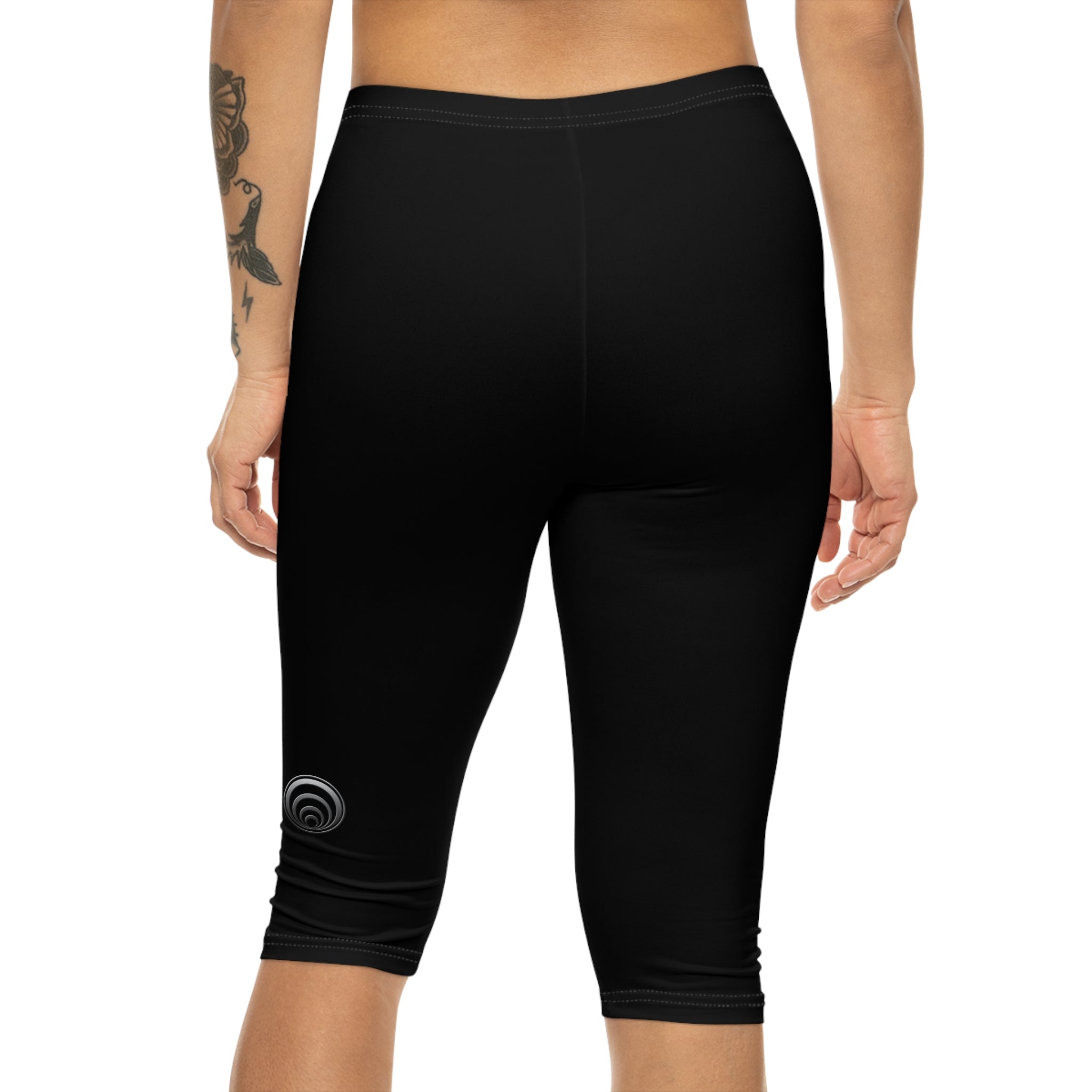 "Particle Oscillations As An Energy Generator."™ - Capri Leggings — Minimal Black Activewear with Subtle Vertical Text