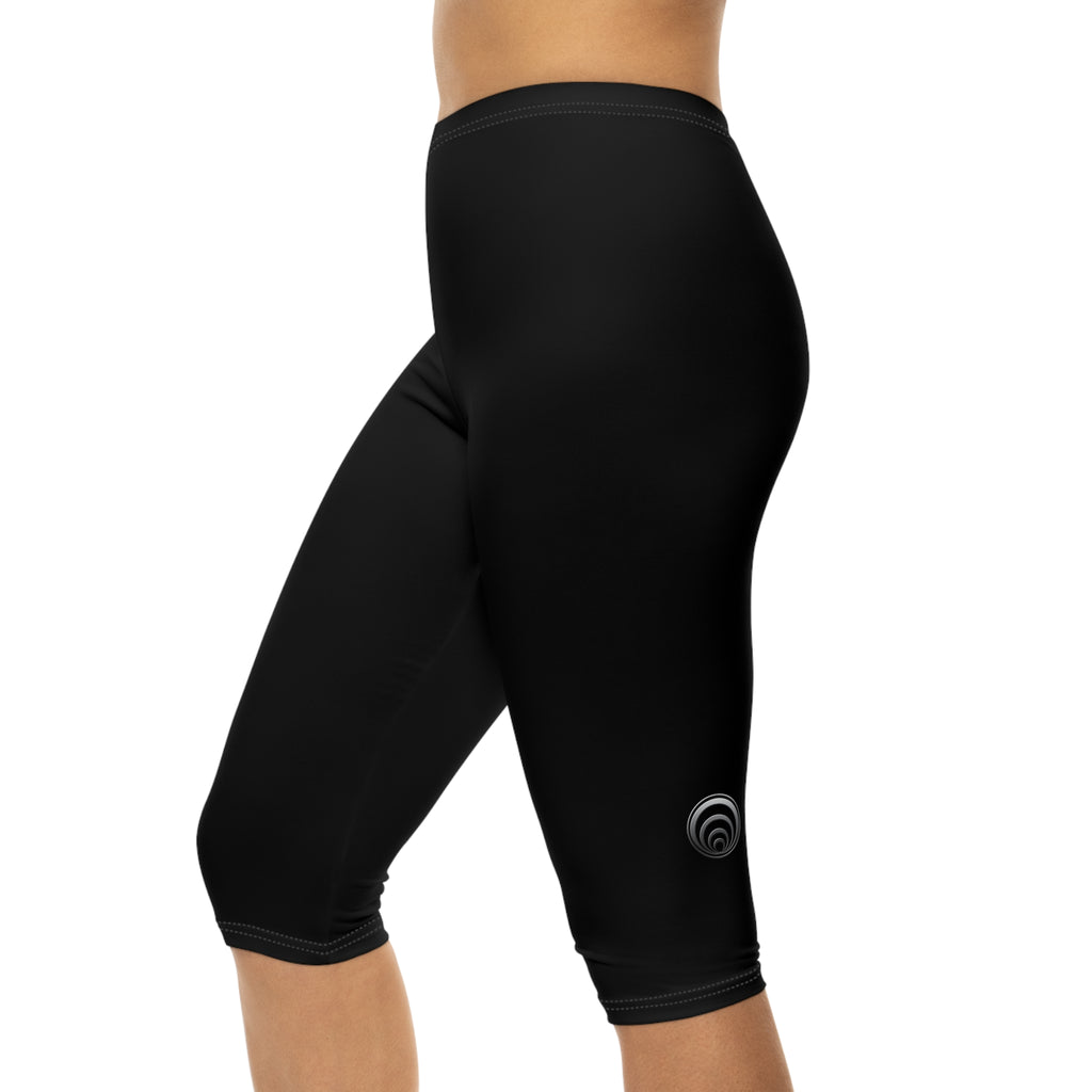 "Particle Oscillations As An Energy Generator."™ - Capri Leggings — Minimal Black Activewear with Subtle Vertical Text